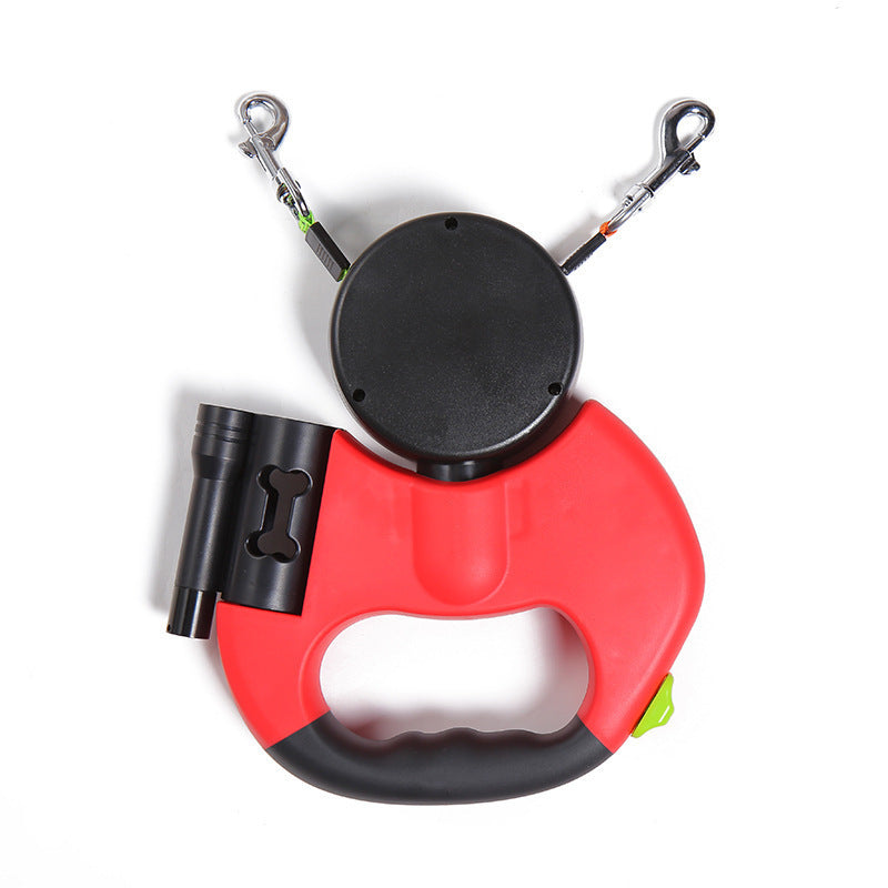 Red retractable dual dog leash with ergonomic handle and built-in waste bag holder