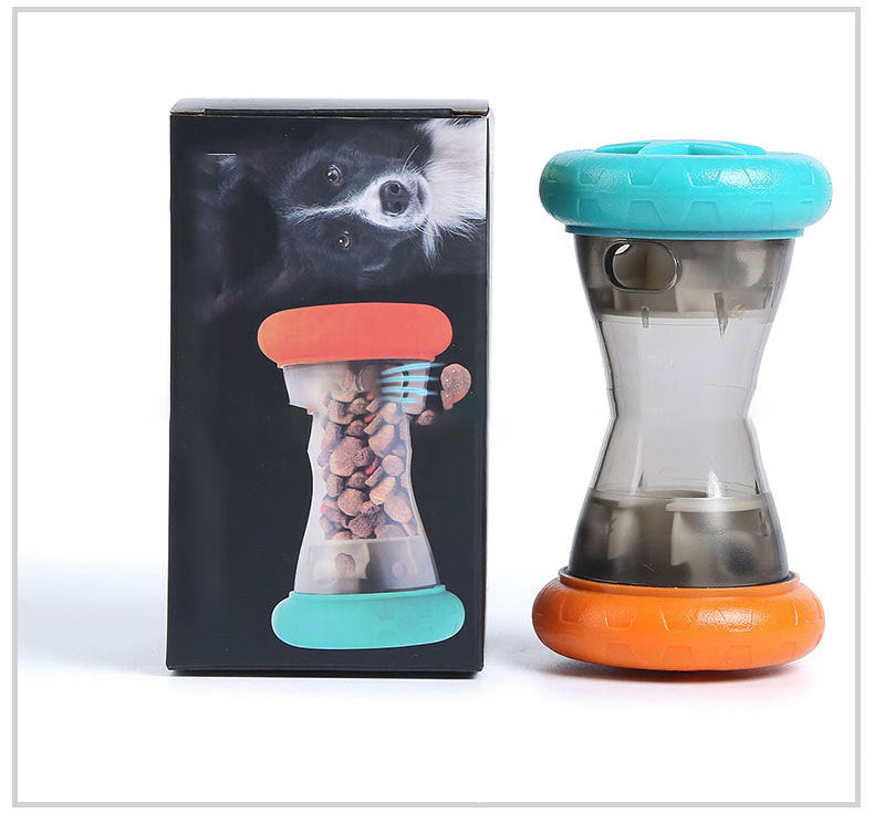 Interactive dog treat dispenser toy with hourglass shape beside product packaging