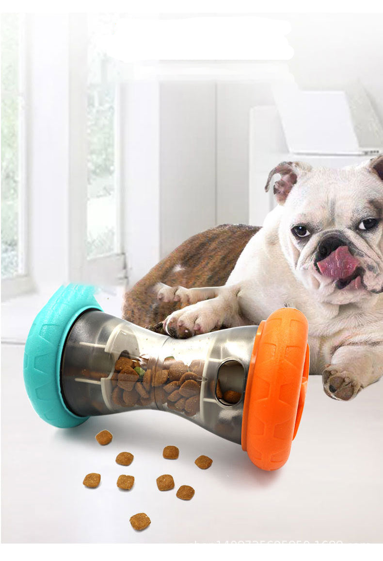 Bulldog beside interactive dog treat toy with kibble in bright indoor setting