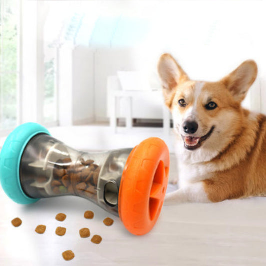 Corgi dog with interactive treat dispensing toy on floor, pet food puzzle feeder