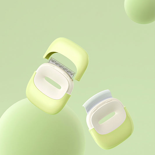 Green and white pet grooming brushes with fine metal bristles on a light green background