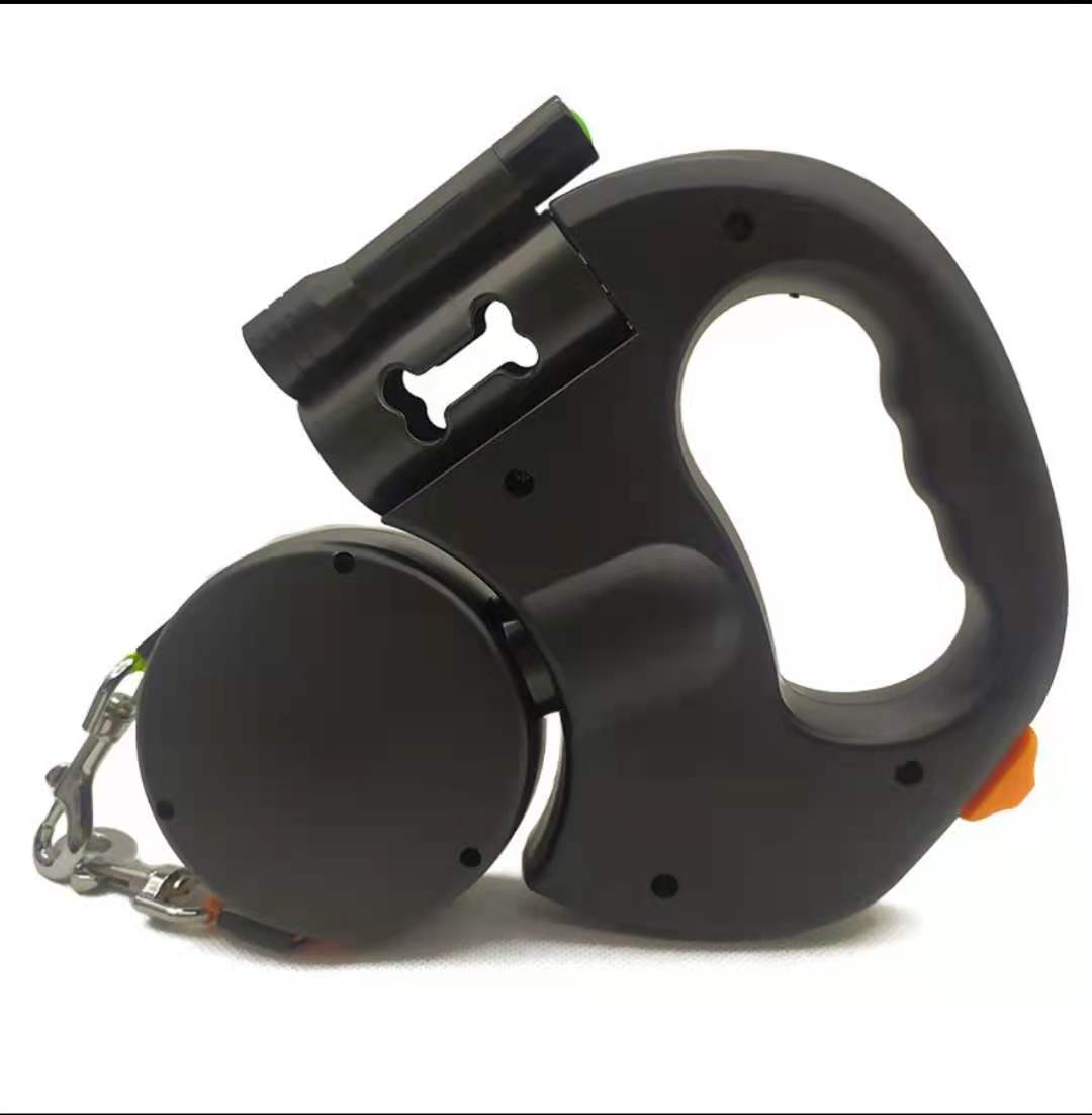 Black retractable dog leash with built-in waste bag holder and ergonomic handle