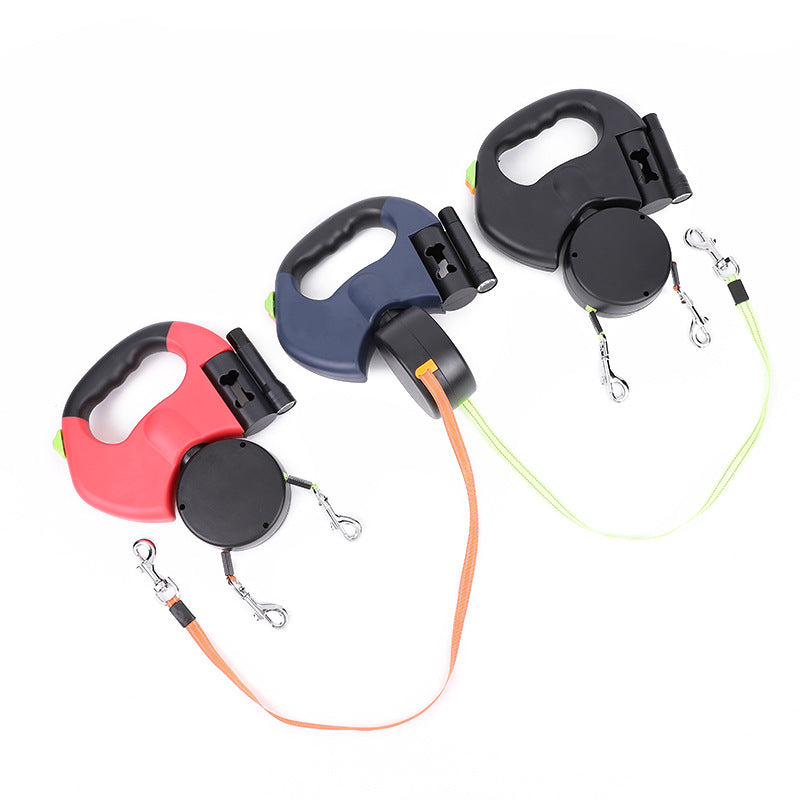 Retractable dog leashes in red, navy, and black with ergonomic handles on white background