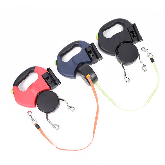 Retractable dog leashes in red, navy, and black with ergonomic handles on white background