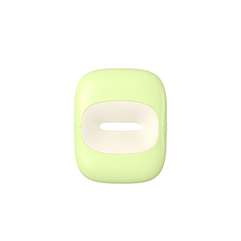 Light green portable pet waste bag dispenser with central slot, isolated on white background